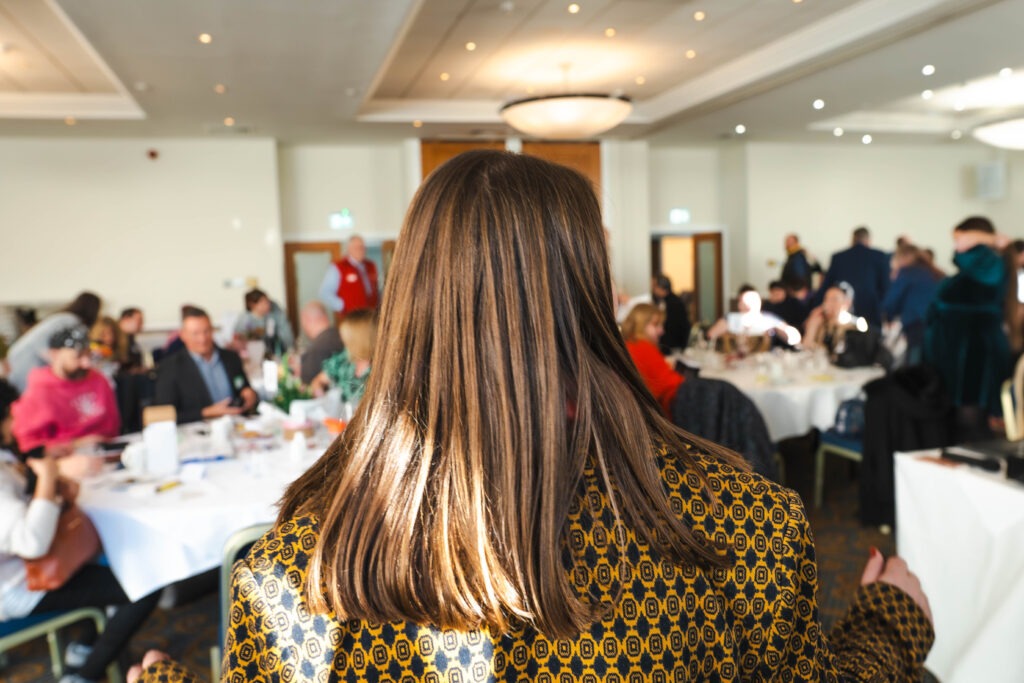back of Nicky Thomas head and the growth community awards 2025